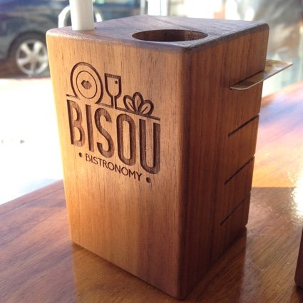 Bisou engraved wooden table block